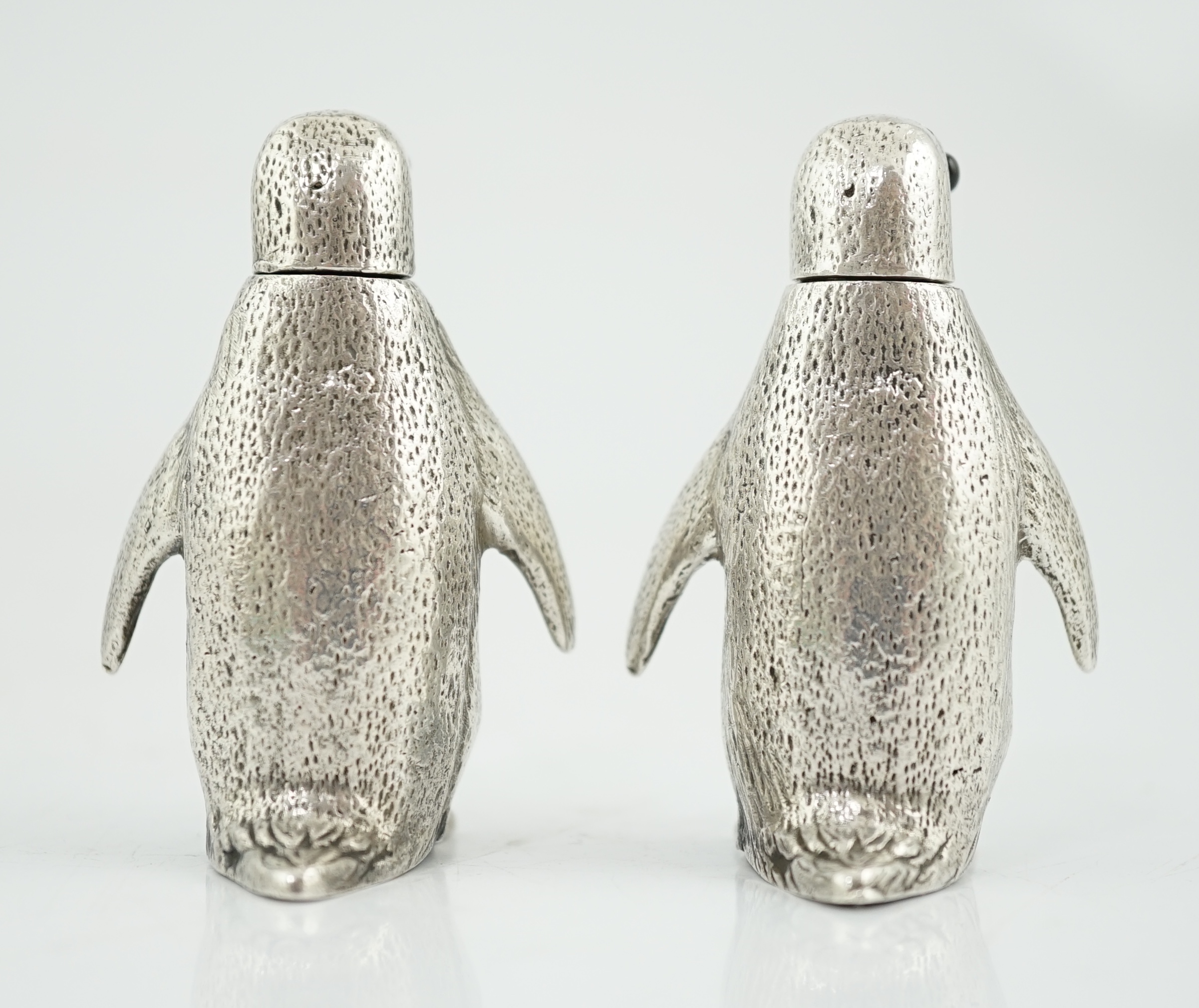 A pair of Elizabeth II silver novelty condiments, modelled as penguins, William Comyns & Sons Ltd